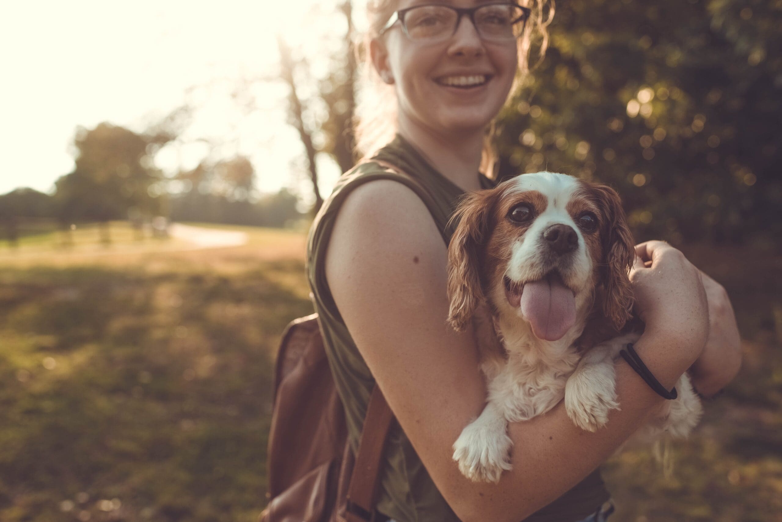 girl holding dog
